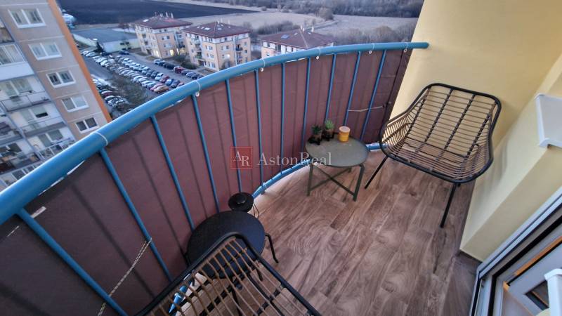 Balcony of a 3-room apartment with a wooden decor floor on Novomeského Street in Poprad.