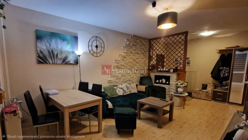 Living room with wood-patterned flooring and stylish seating in a three-room apartment.