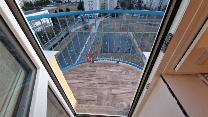 A balcony with a wooden decor floor in a 3-room apartment on Novomeského Street, Poprad.