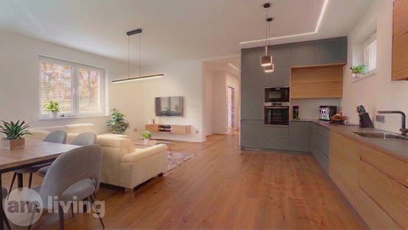 Living room in a family house with a sofa and a wooden decor floor.