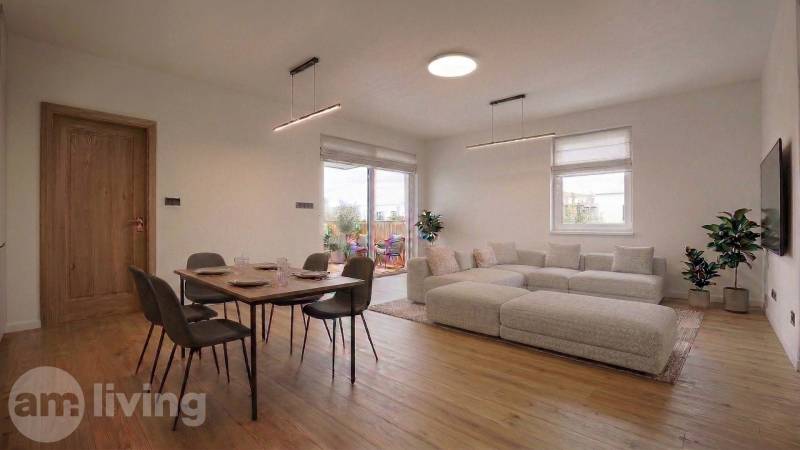 Living room in a family house with a dining table and a wooden decor floor.