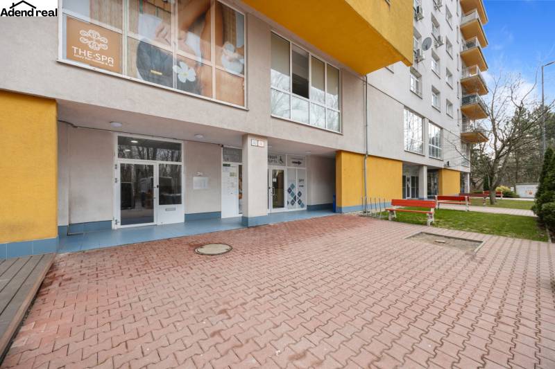 The exterior of the building on Antolska Street in Bratislava - Petržalka with commercial spaces.