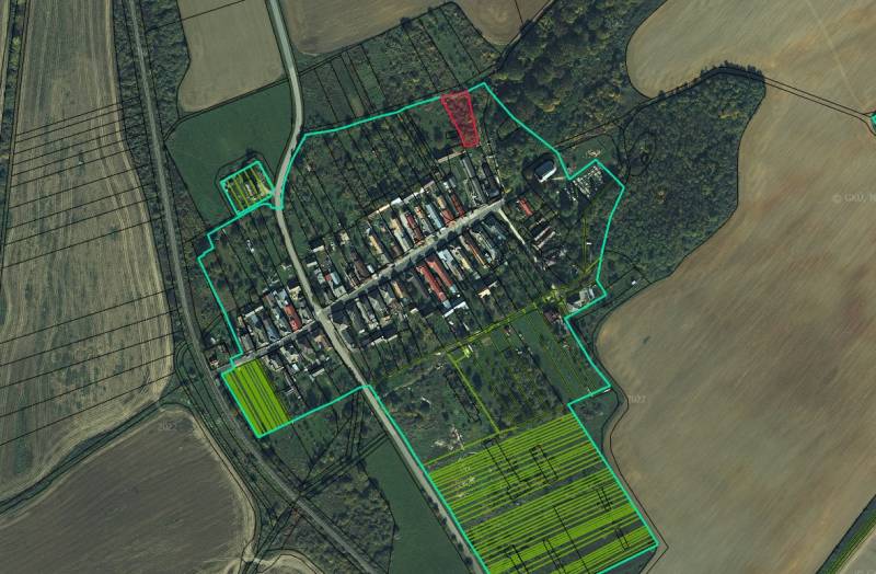 Aerial view of recreational lands in the village of Gemerské Teplice, surrounding fields and forests.