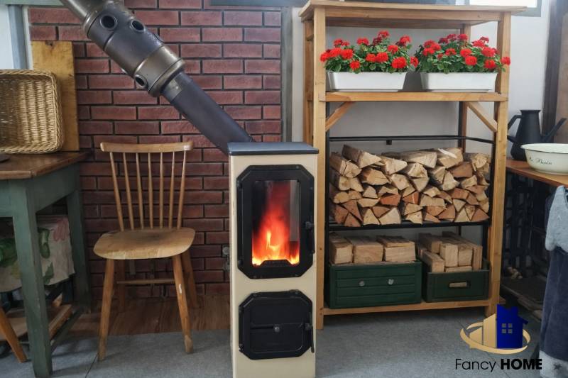 A solid fuel fireplace with a supply of wood and flowers on the garden shelf.