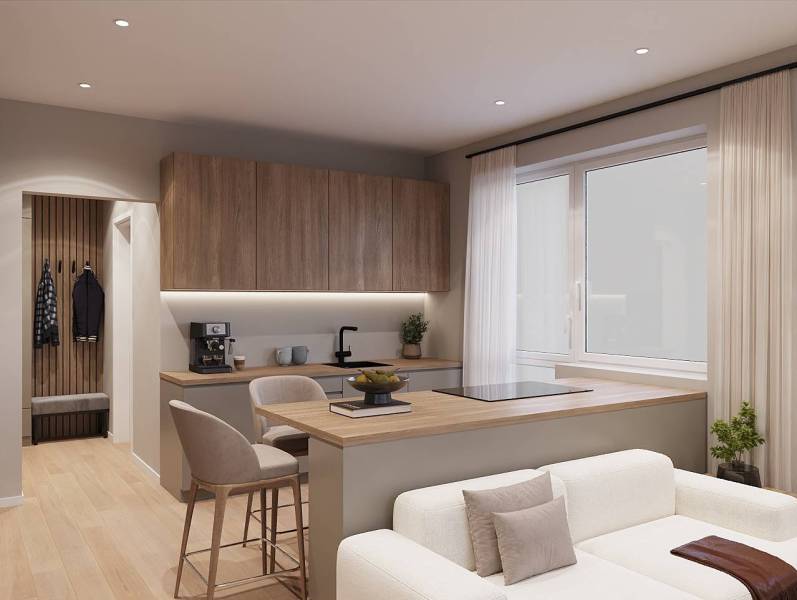 A kitchen in a studio apartment with a wood-patterned floor and light-colored seating.