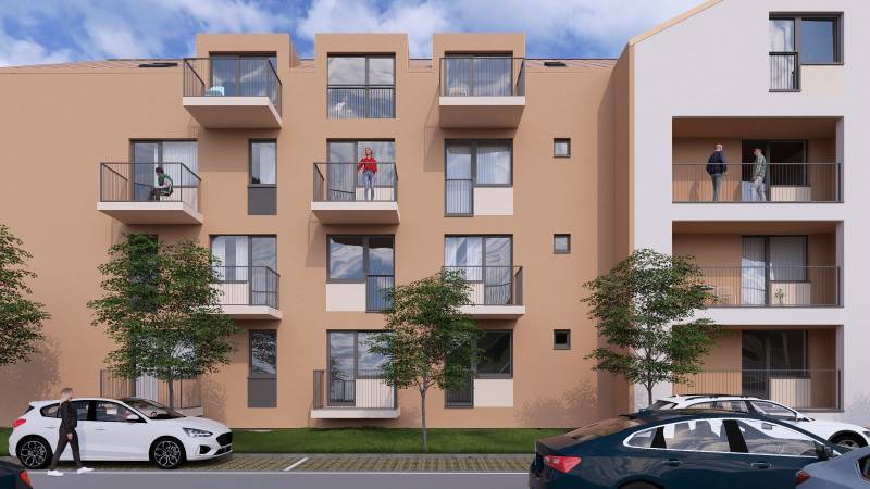 An apartment building in Poprad with balconies, parked cars, and a sidewalk.