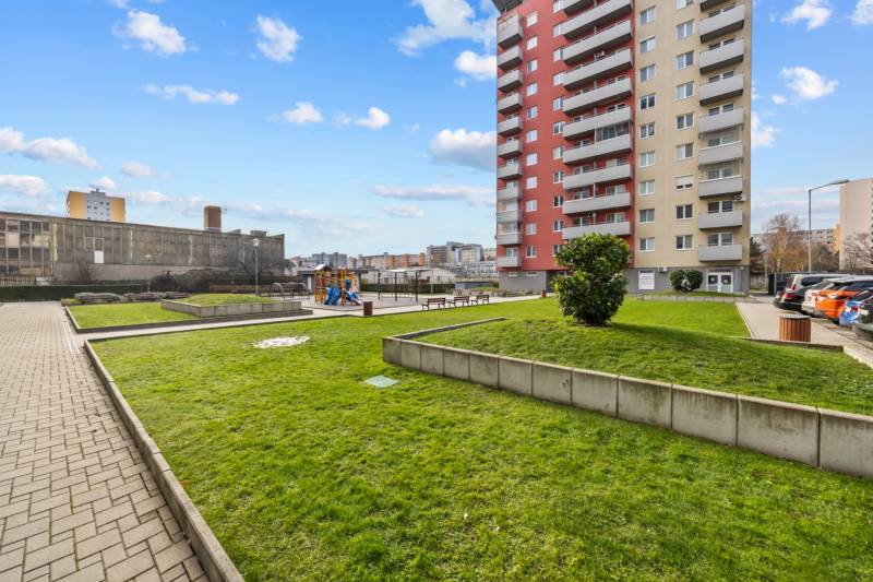 Apartment building with a children's playground in the district of Bratislava - Dúbravka on Nejedlého Street.