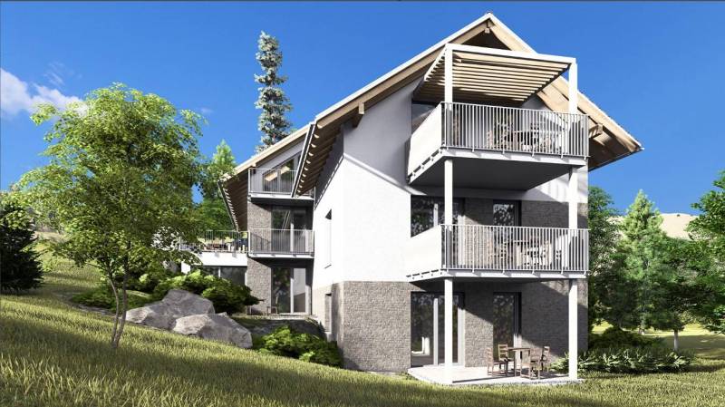 The exterior of an apartment building in the High Tatras with a garden and spacious balconies.