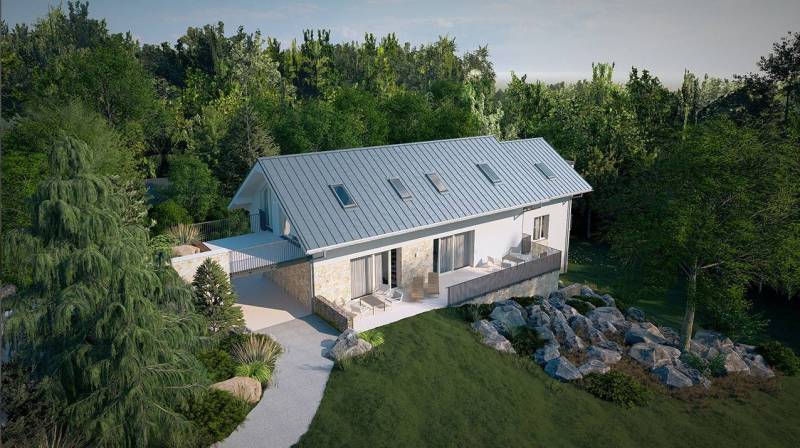 A family house in the High Tatras surrounded by greenery and rocks with a spacious terrace.