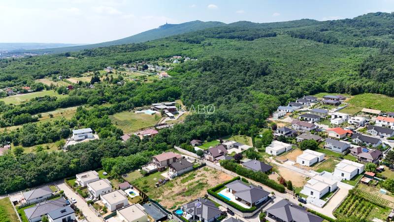 Aerial view of residential plots between streets and greenery in Štitáre on Pod Agátmi.
