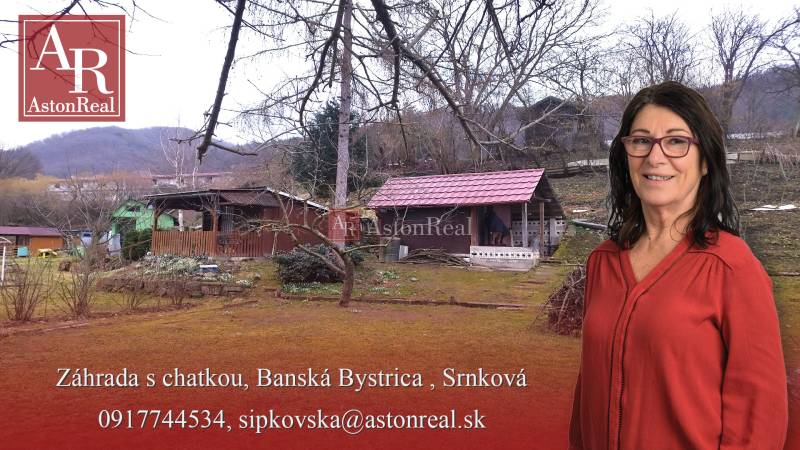 A garden with a cottage in Banská Bystrica on Srnkova Street with fruit trees.