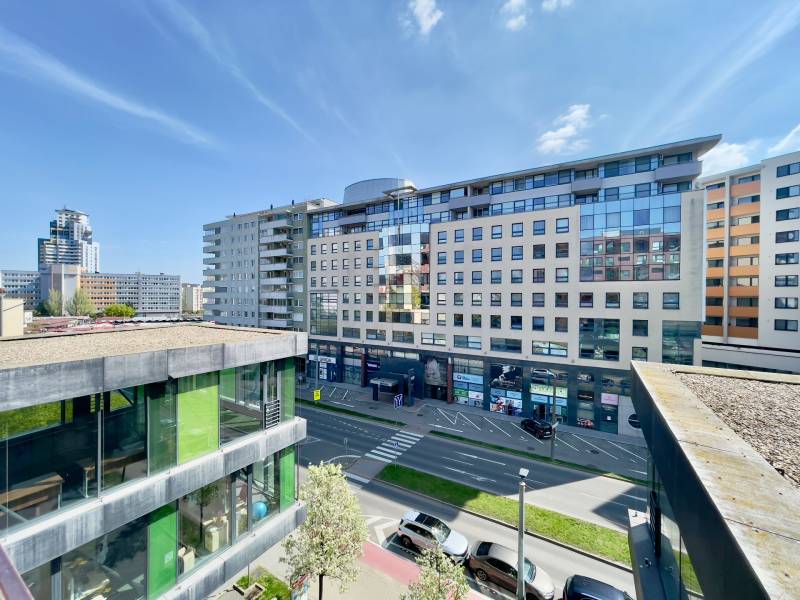 View of Košická Street with shops and apartment buildings in Bratislava - Nivy.