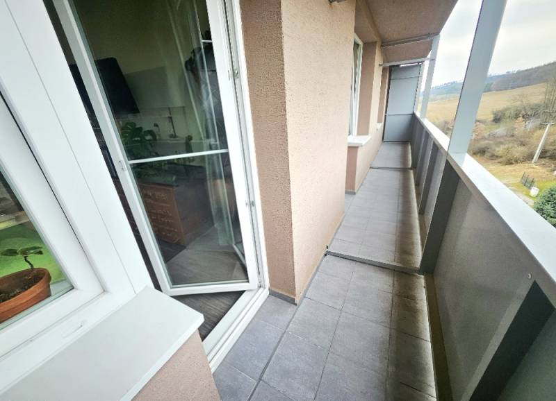 A balcony in a 3-room apartment with a view of the countryside in Bánovce nad Bebravou.