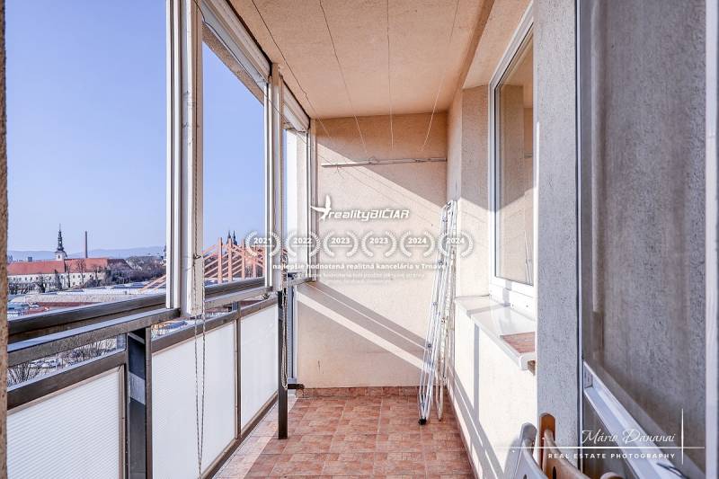The balcony of a 3-room apartment on Spartakovská Street in Trnava with a view of the city.
