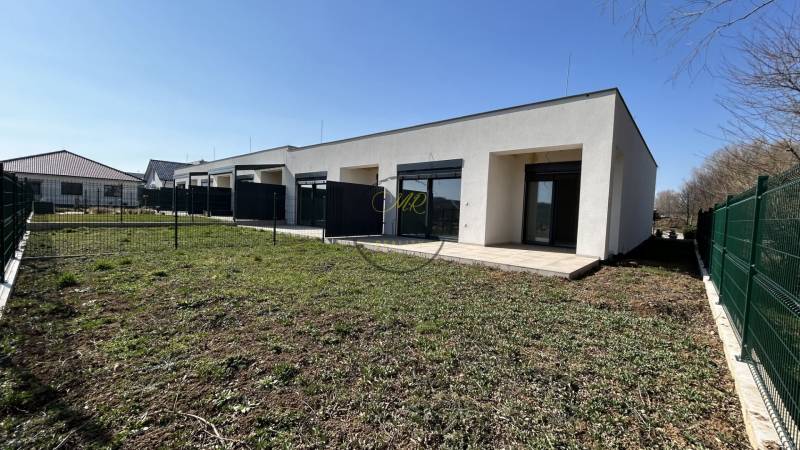 A family house in Klasov with a terrace and garden, separated by a fence.