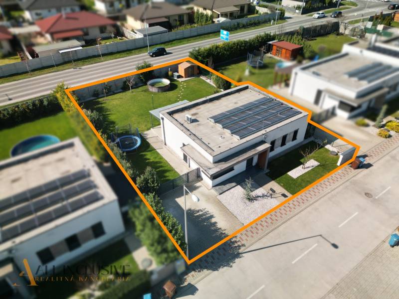A family house in Dunajská Streda with a large garden, a trampoline, and solar panels on the roof.