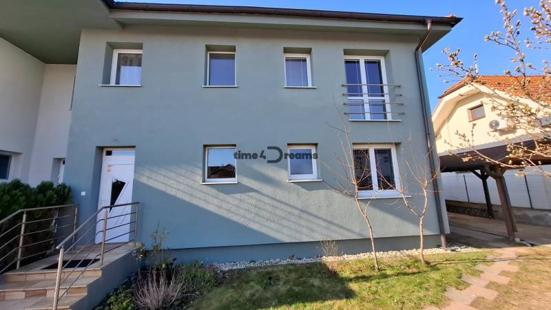 A family house with a front garden on Nitrianska Street in Nitra with a staircase and railing.