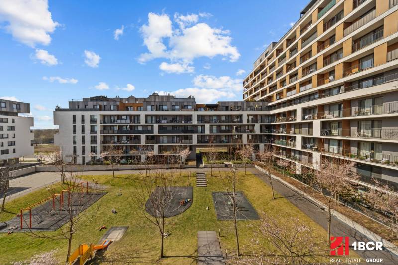 The exterior of the apartment complex on Zuzany Chalupovej in Bratislava - Petržalka with a playground.
