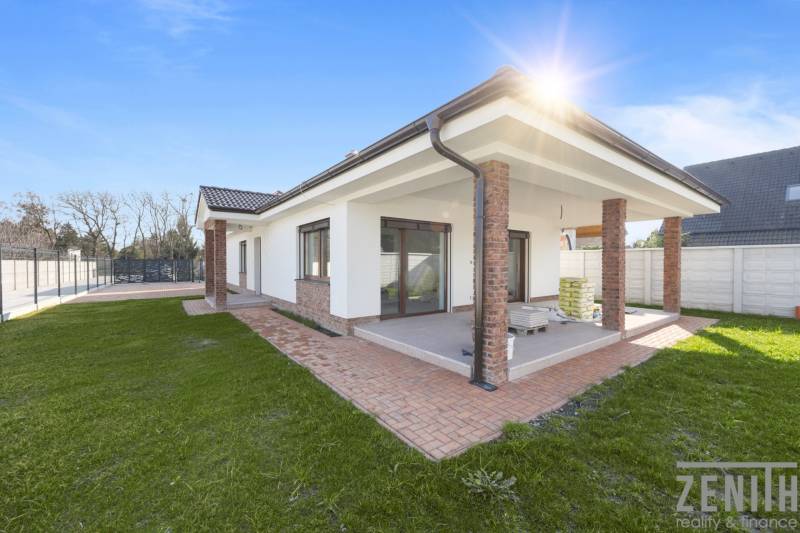A family house in Vojka nad Dunajom with a landscaped garden and a covered terrace.