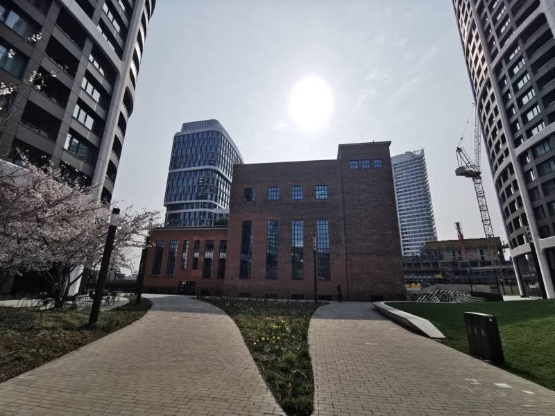 In Bratislava - Staré Mesto on Čulenova Street, you can see modern architecture and blooming trees.