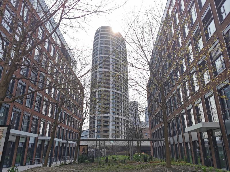 A high-rise building among brick buildings on Čulenova Street in Bratislava - Staré Mesto.