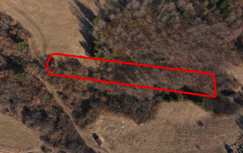 Agricultural and forest lands near Námestovo, bordered by a red line, in the autumn season.