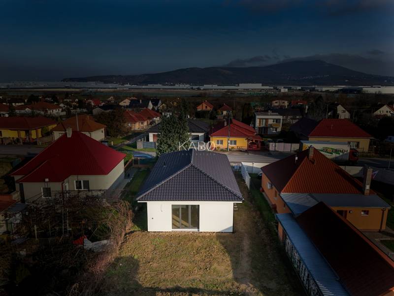 A family house on Rastislavova Street in Lužianky surrounded by other houses and greenery.