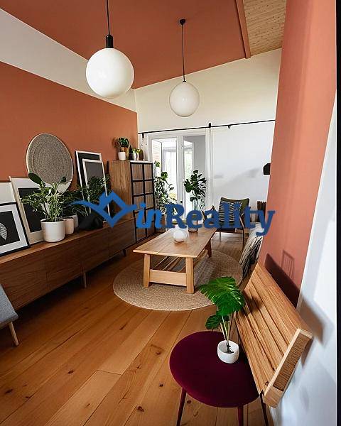 Interior of a family house with a wooden decor floor and houseplants.