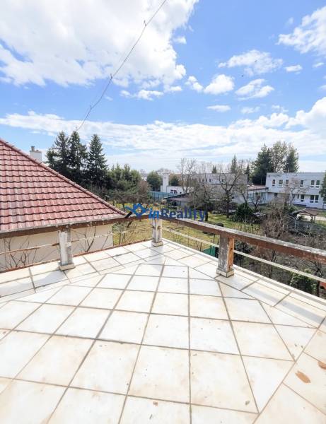 A balcony of a family house on Gorkého Street in Rimavská Sobota with a view of the surroundings.