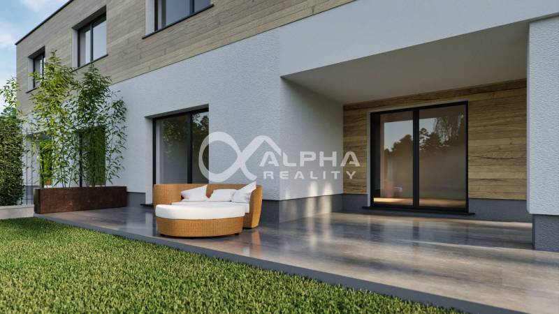 A family house in Harichovce with a terrace, comfortable seating, and wooden decor on the facade.