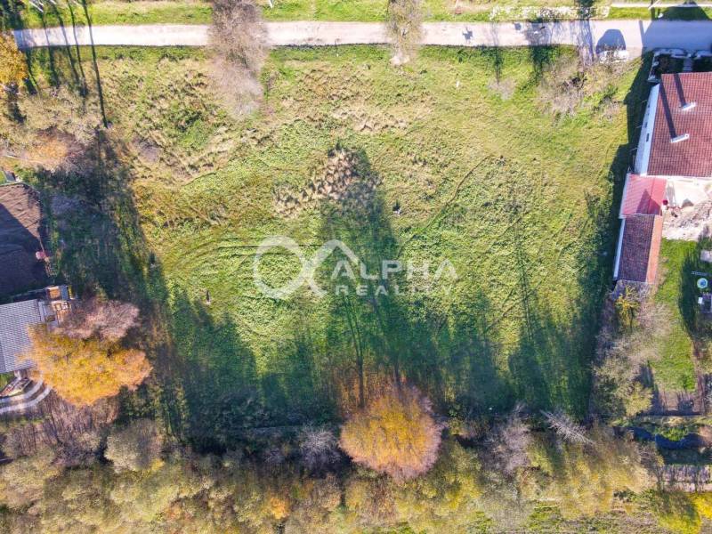 An aerial photograph of a residential plot in Spišské Podhradie with surrounding greenery.