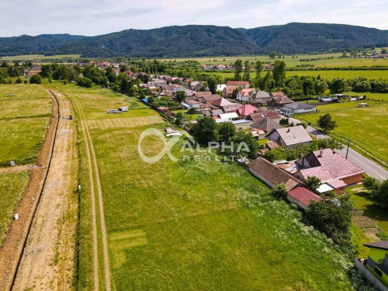 Plots - housing in Betlanovce with a view of the surrounding hills and village buildings.