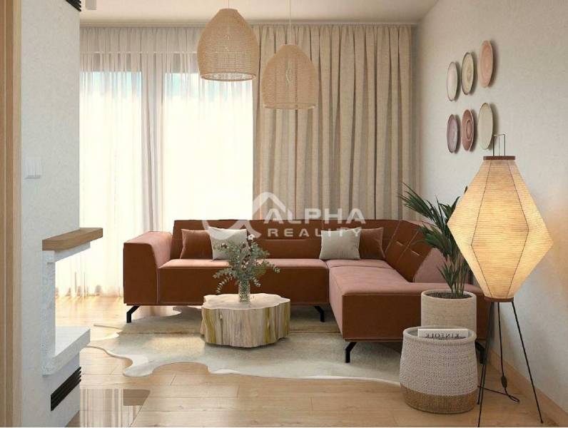Living room with wood-patterned flooring, a sofa, and decorative lighting from the category Real Estate - Housing.