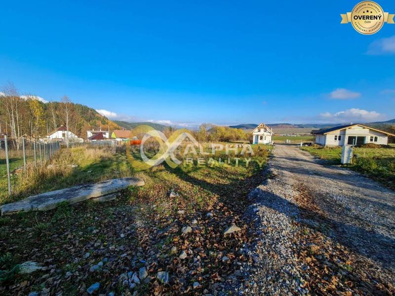 Plots - housing in Markušovce surrounded by greenery, visible buildings and access road.