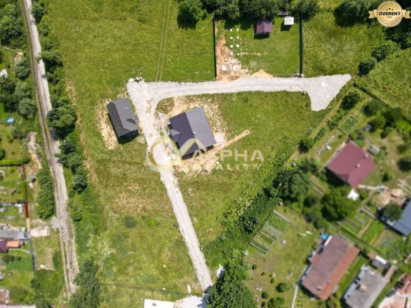Aerial view of residential land in Markušovce with road infrastructure.