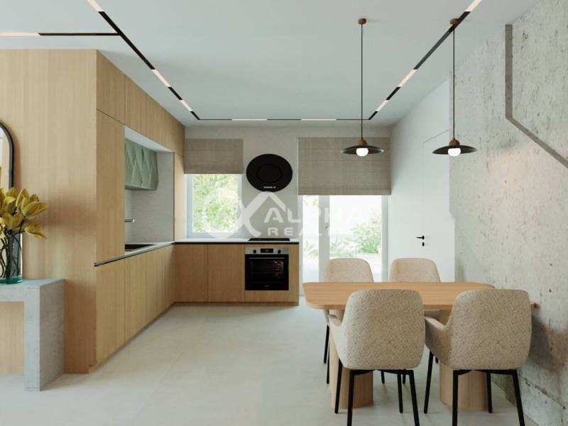 A bright kitchen with a dining table and chairs in a 3-room apartment, with a wooden decor floor.