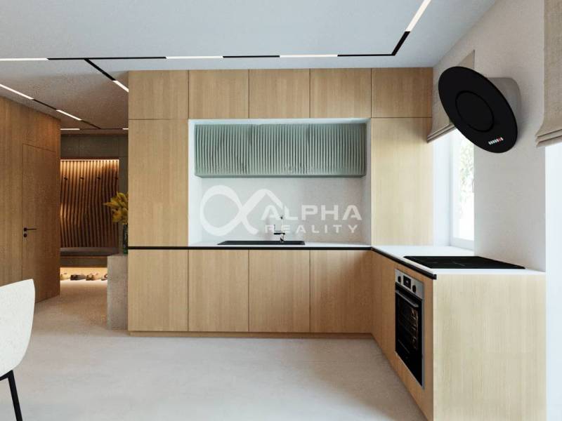A kitchen with a wood-patterned floor and built-in appliances in a 3-room apartment.