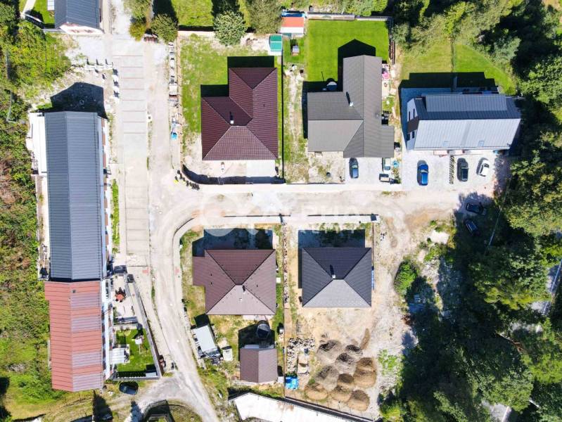Aerial view of the building development in Spišská Nová Ves, including houses and roads.