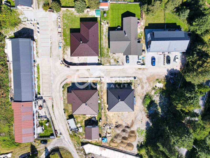 A top-down view of residential houses and roads in Spišská Nová Ves.