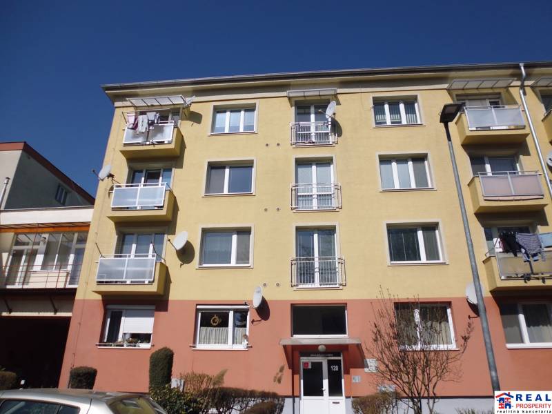 Apartment building in Prešov on 17. novembra Street with balconies and satellites.