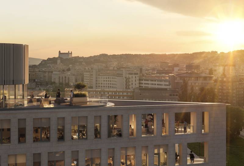 A view of the building at sunset in Bratislava, Pribinova, with a view of the castle.