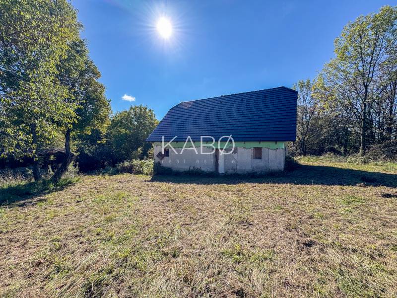 A building surrounded by greenery on agricultural and forest land in Lackov.