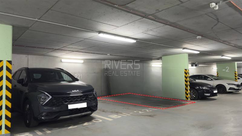 Parking space between vehicles in the garage on Račianska Street 26 F in Bratislava.