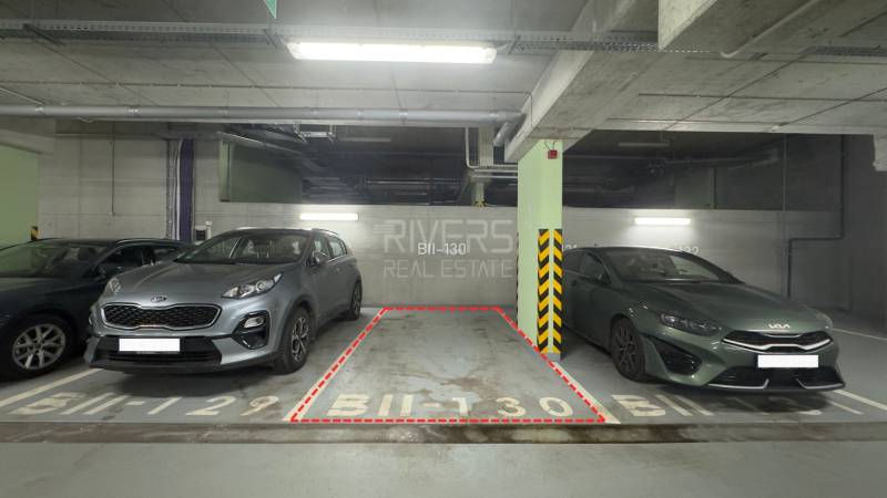 Parking spot BII-130 between two cars in the garages.