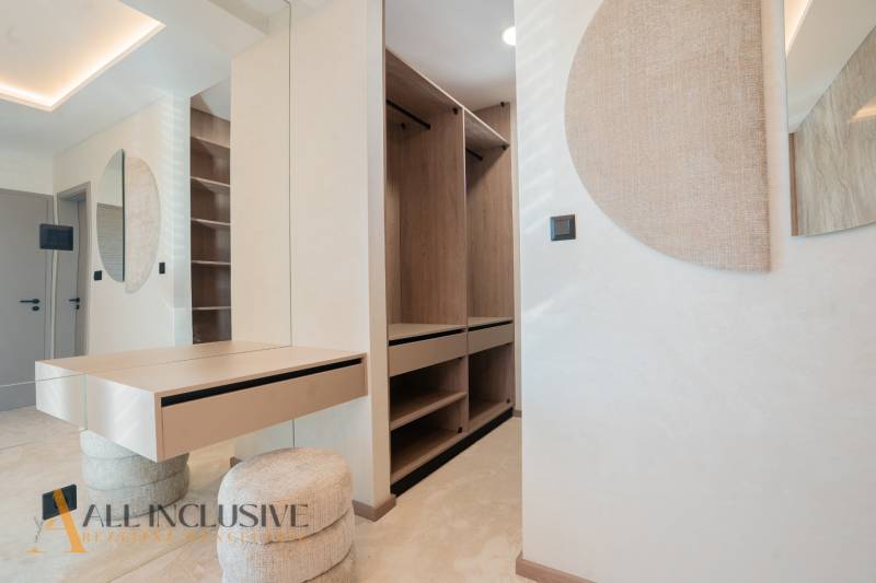 Interior of a family house with a practical wardrobe and a mirrored table.