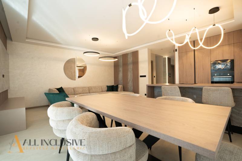 Interior of a family house with elegant furniture, circular lighting fixtures, and mirror decorations.