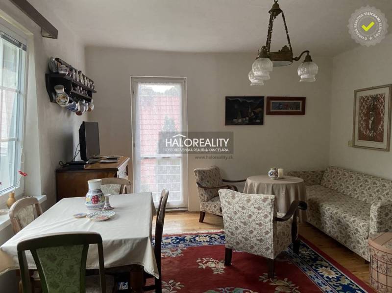 Interior of a family house with furniture, TV, table, sofa, and floor with wood decor.