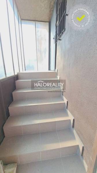 A staircase with a wall of windows in offices.