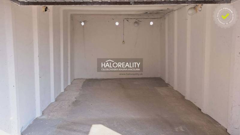An empty garage with a concrete floor, part of offices in Senec.