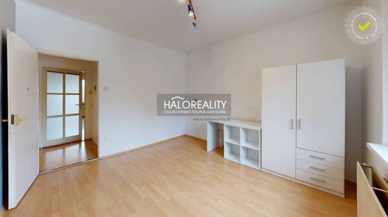 A 2-room apartment with a bright interior and furniture, and a floor with a wooden decor.